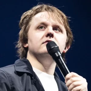 close up of Lewis Capaldi with a microphone